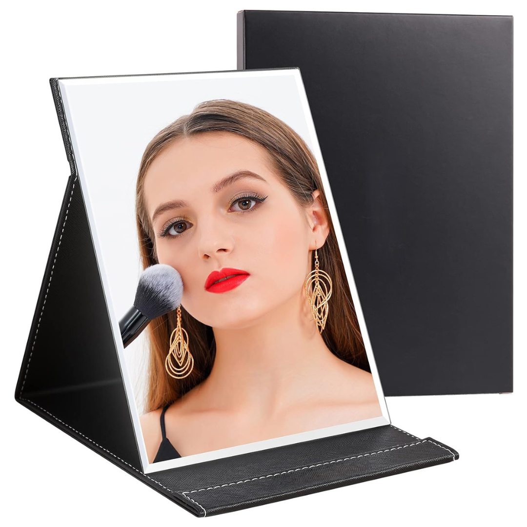 Women's portable compact makeup mirror with adjustable stand, perfect for travel & vanity.