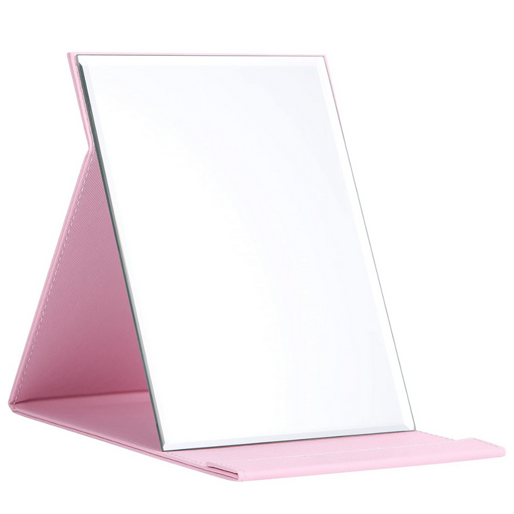 Women's compact cosmetic mirror featuring an adjustable stand for hands-free use, travel-friendly.