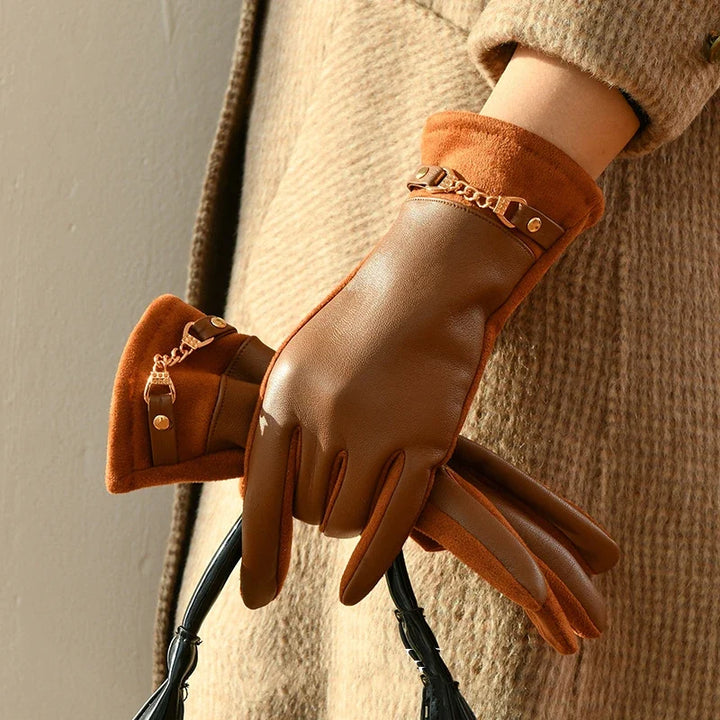 Warm women's genuine leather gloves with luxurious cashmere lining, ideal for cold weather protection.