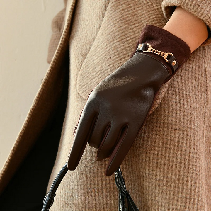 Women's warm leather gloves with plush cashmere lining, offering elegant winter handwear.