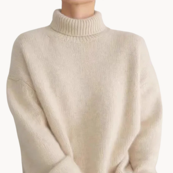 Stylish women's turtleneck sweater. Versatile knitwear for fall outfits, offering warmth and comfort.
