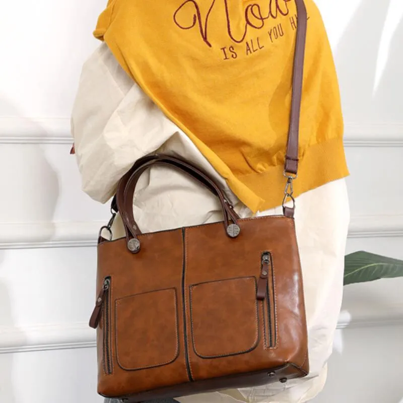 Elegant women's genuine leather shoulder bag with a spacious interior, ideal for daily essentials.