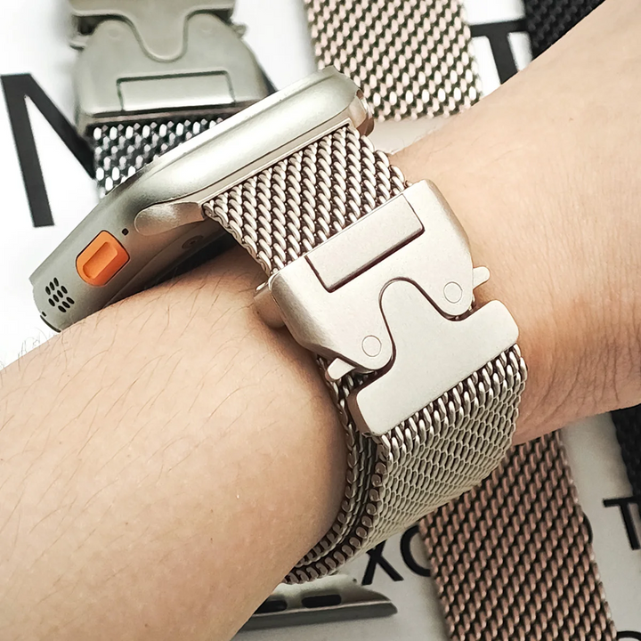 Stylish women's smartwatch band in stainless steel, a sleek mesh accessory for her device.