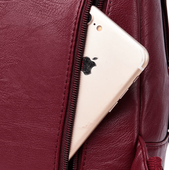 Women's premium leather backpack, water-resistant for all-weather daily use.
