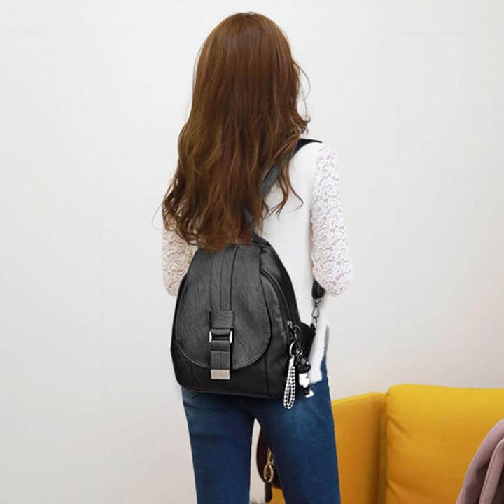 Women's water-resistant leather backpack, perfect for urban exploration and travel.