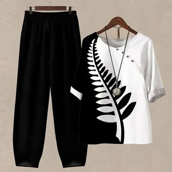 Stylish women's printed blouse and flowy pants set, an effortlessly chic two-piece outfit for any occasion.