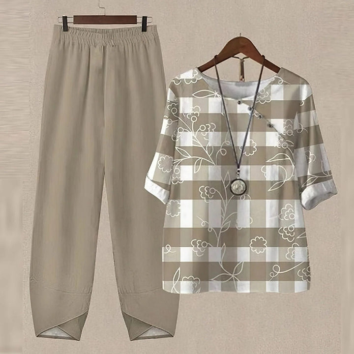 Chic women's printed blouse and pants outfit, designed for comfort and modern summer fashion.