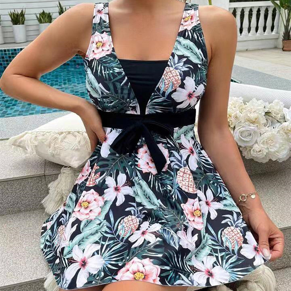 Elegant women's swimsuit: printed halter tankini and a matching skirt, great for vacation and beachwear.