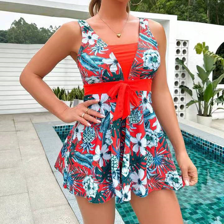 Printed halter tankini for women with a flattering flowy skirt, essential swimwear for summer.