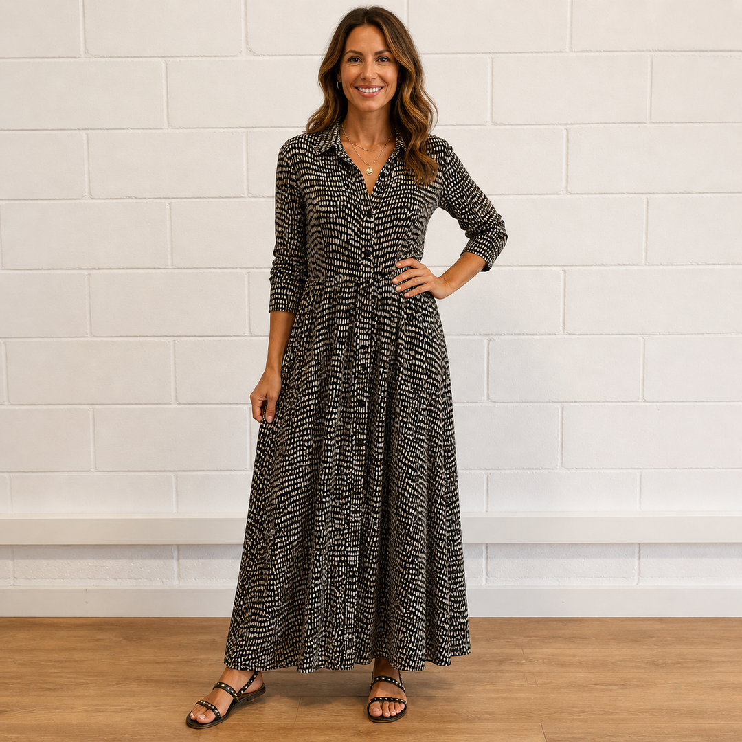 Women's printed long sleeve button-front maxi dress, versatile for day or evening wear. Elegant & flattering fit.