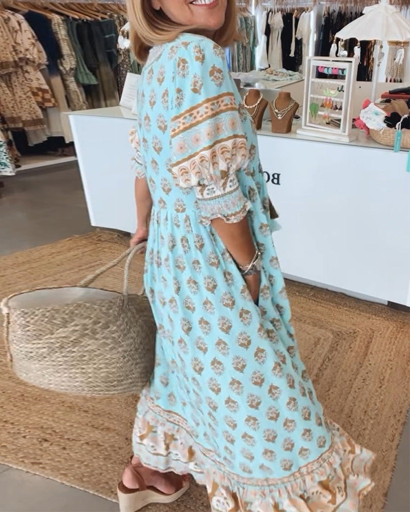 Bohemian midi dress for women, perfect for summer casual wear. Stylish print, V-neck, and pockets.