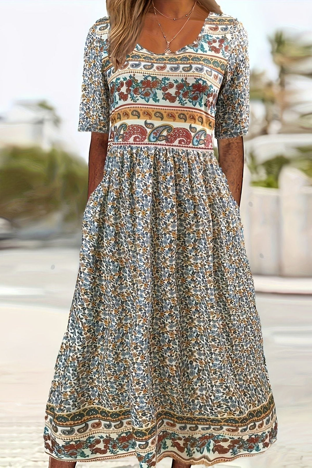 Women's printed relaxed fit midi dress. Comfortable and stylish for casual summer days.
