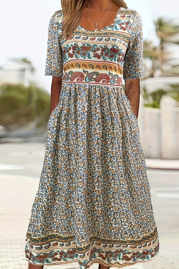 Women's printed relaxed fit midi dress. Comfortable and stylish for casual summer days.