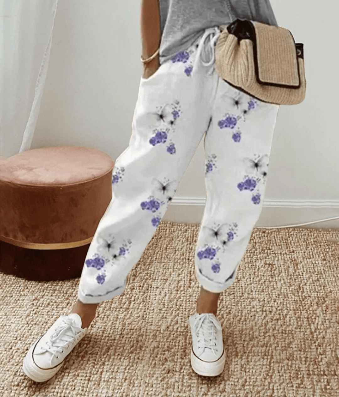 Versatile women's fashion trousers with a unique print and adjustable waist, perfect for lounge or casual outfits.