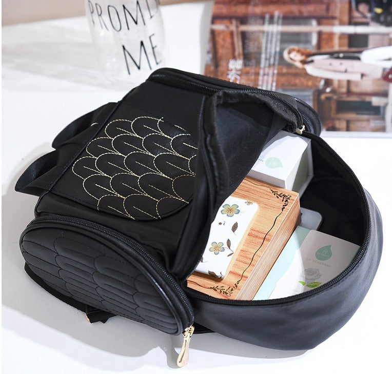 Multi-pocket women's casual backpack in PU leather with unique owl print.