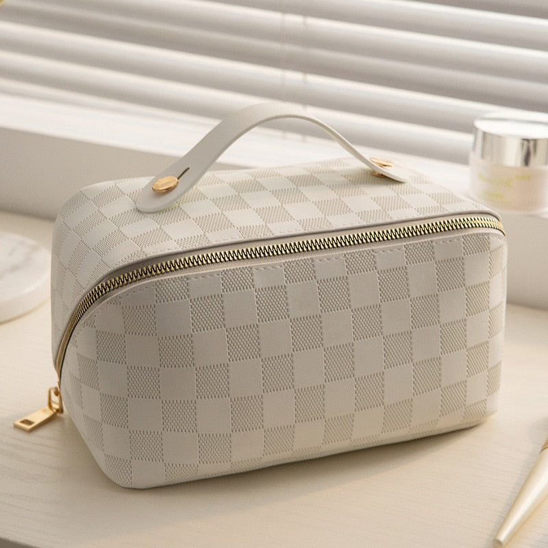 Stylish women's PU leather cosmetic bag with a zipper, designed as a portable makeup organizer