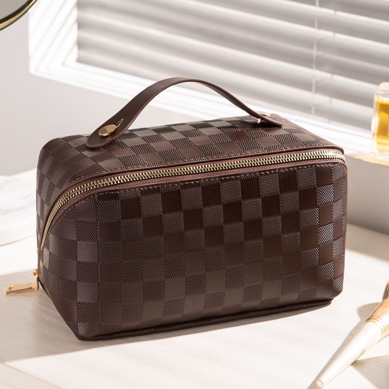Top view of a women's PU leather cosmetic bag, an elegant travel makeup organizer