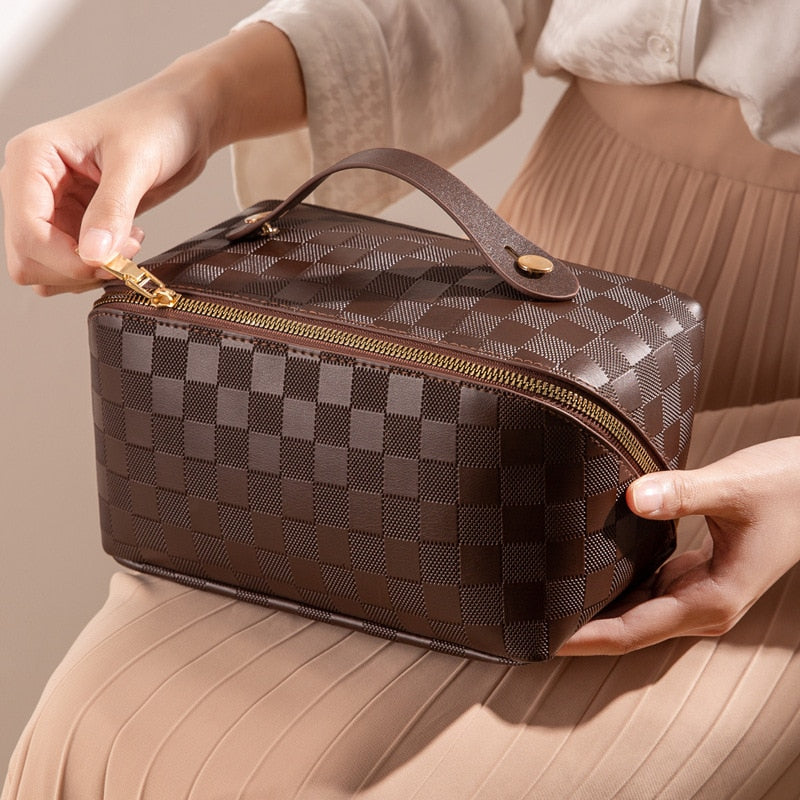 Close-up of the textured PU leather on a women's cosmetic bag, highlighting its durable material
