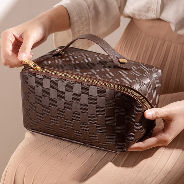 Close-up of the textured PU leather on a women's cosmetic bag, highlighting its durable material