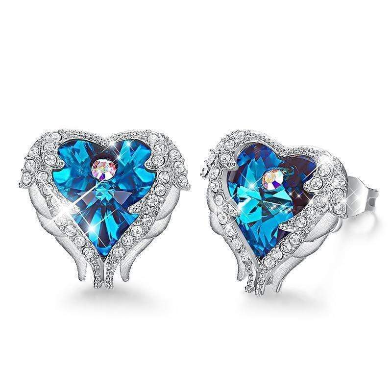Close-up of women's crystal angel wing heart earrings, with purple & blue accents. Ideal spiritual gift.