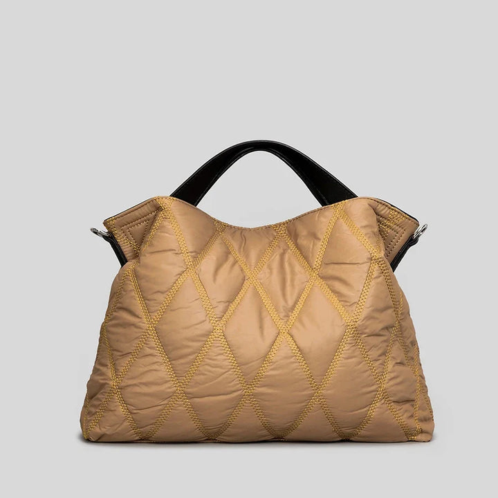 Spacious women's shoulder tote bag with a quilted design, offering ultimate comfort and ample storage.