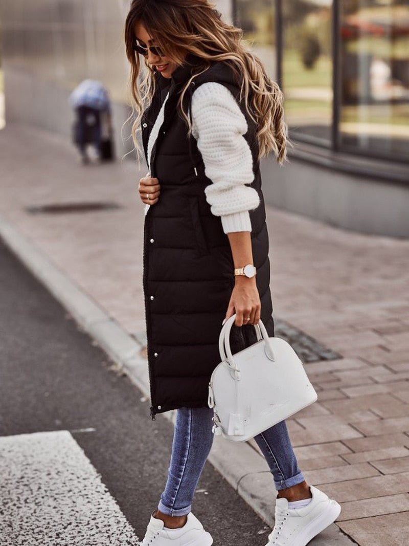 Stylish women's knee-length quilted gilet, perfect for fall fashion & cozy winter outerwear.