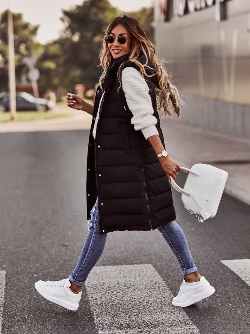 Comfortable women's quilted sleeveless coat, knee-length for extra winter warmth and casual wear.