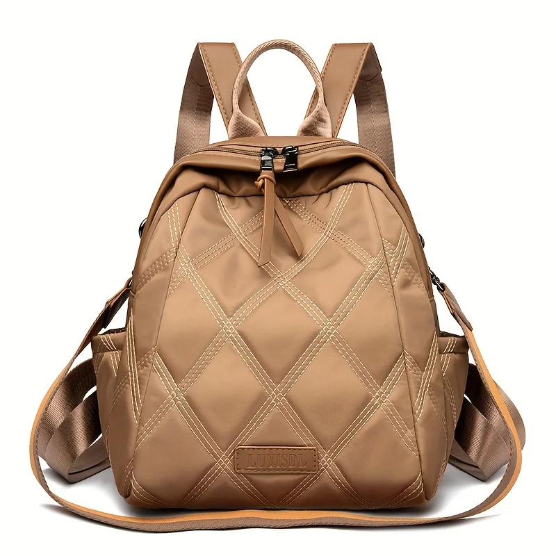 Women's quilted nylon convertible backpack, stylish & versatile for everyday and travel.