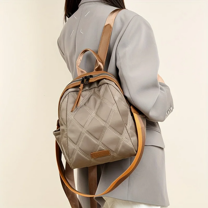 Women's versatile quilted nylon convertible backpack, easily transforms from backpack to shoulder or crossbody.