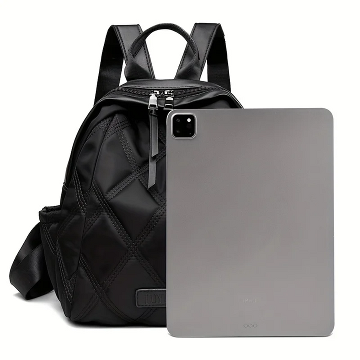 Front view: Stylish women's quilted nylon convertible backpack. Versatile for travel and daily use.