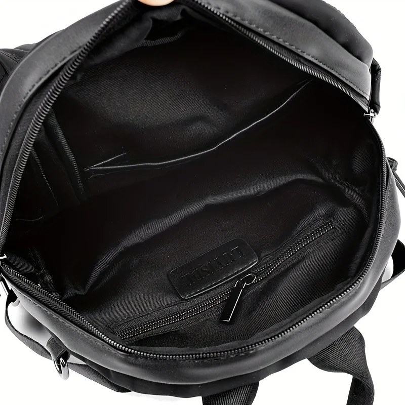 Back view: Women's quilted convertible backpack with adjustable straps. Transforms to shoulder or crossbody.