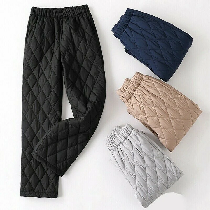 Woman enjoying comfort in quilted puffer joggers, ideal for winter activities & warmth.