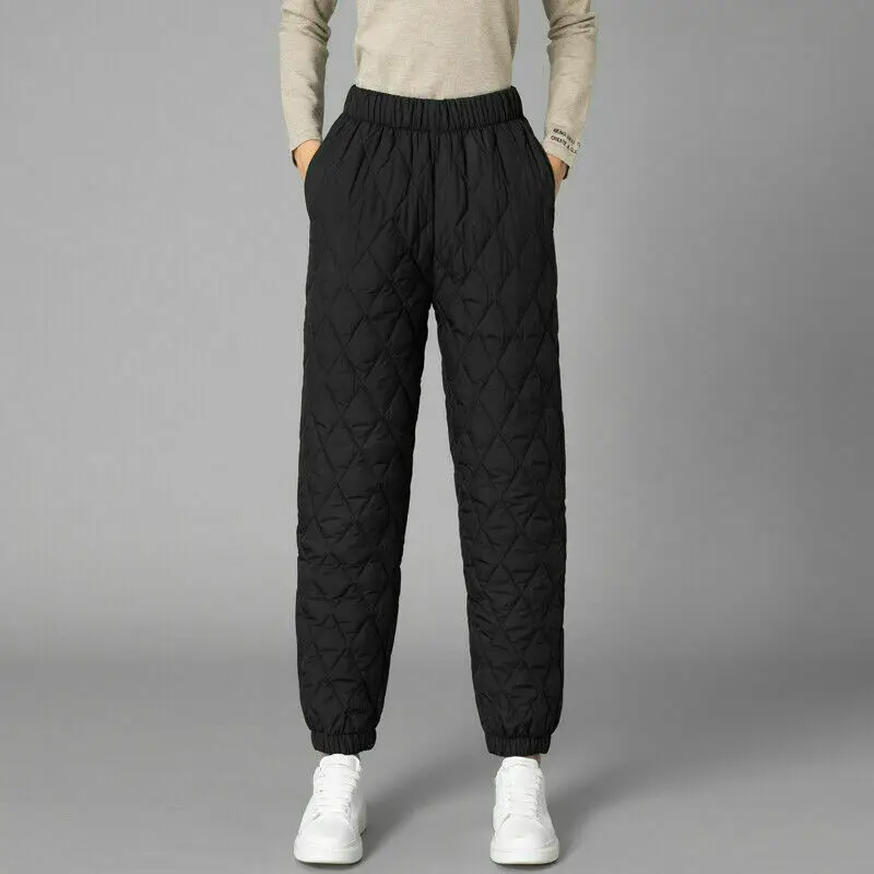 Woman walking in warm quilted puffer joggers, comfortable, fashionable & athletic casual.