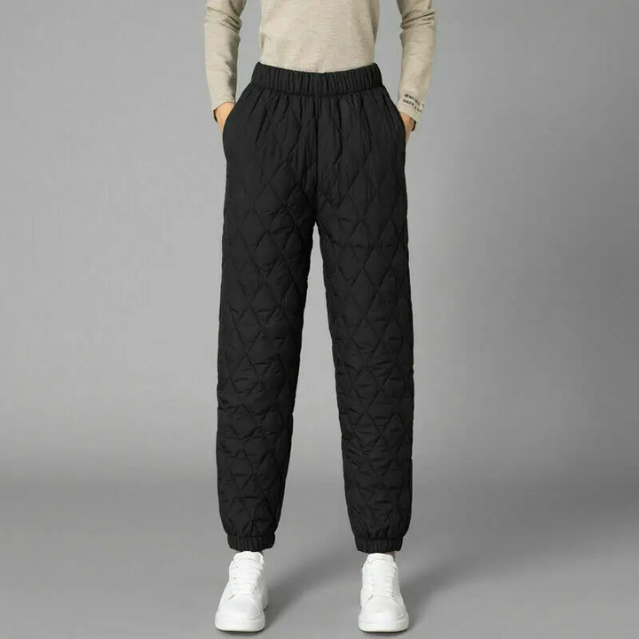 Woman walking in warm quilted puffer joggers, comfortable, fashionable & athletic casual.