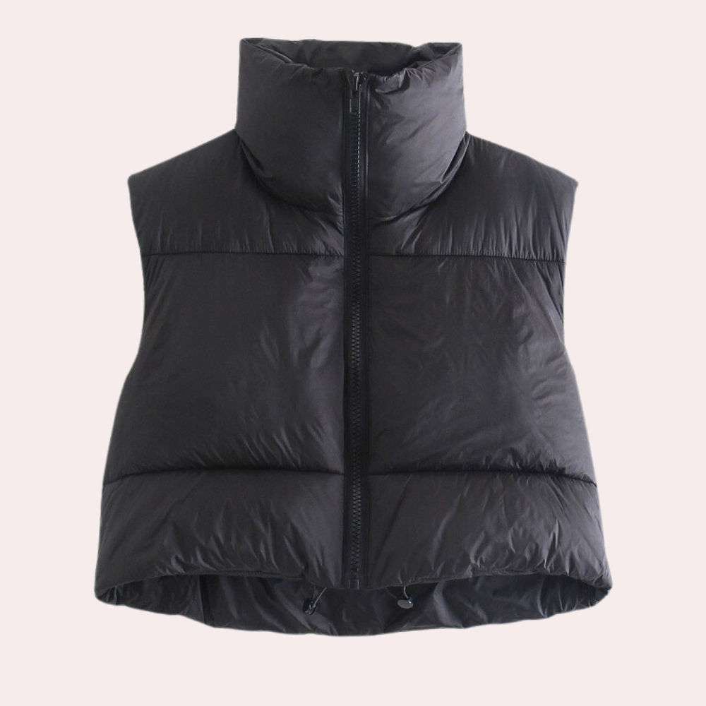 Front view of a women's short quilted gilet. Lightweight polyester outerwear, ideal for layering and versatile fashion.