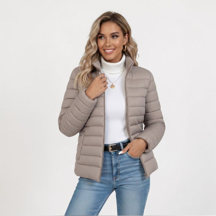 Women's quilted winter jacket with stand collar & full zip. Perfect for fall & everyday comfort.