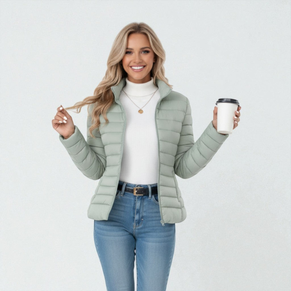 Back view of women's slim fit quilted jacket. Full zip, stand collar for everyday comfort & winter warmth.