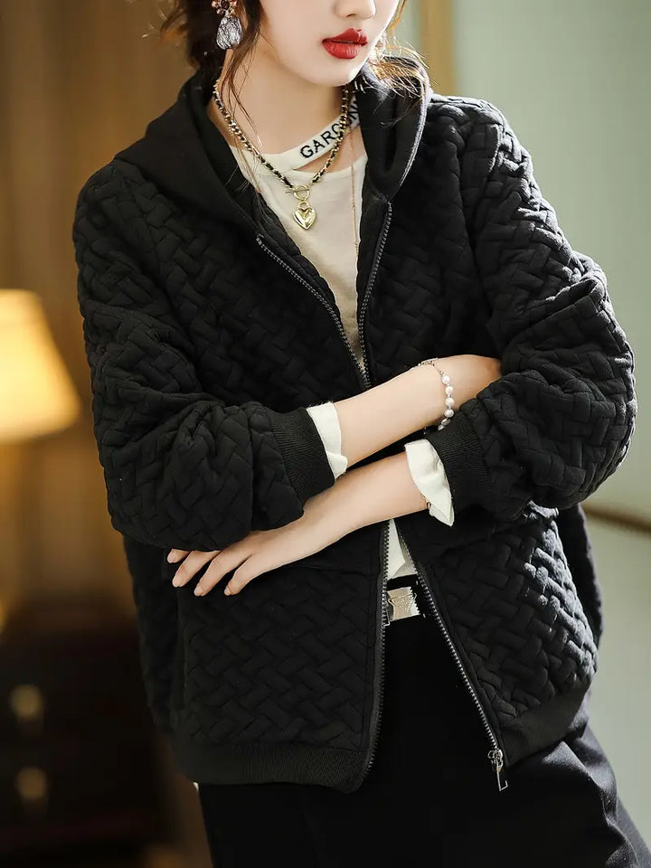 Active women's quilted zip-up hoodie, perfect for brisk walks or casual outdoor activities.