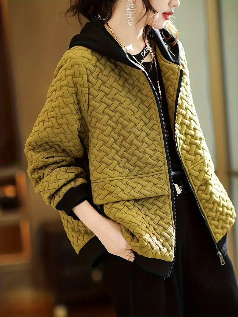 Stylish women's quilted zip-up hoodie, a casual chic layering piece for comfortable everyday wear.