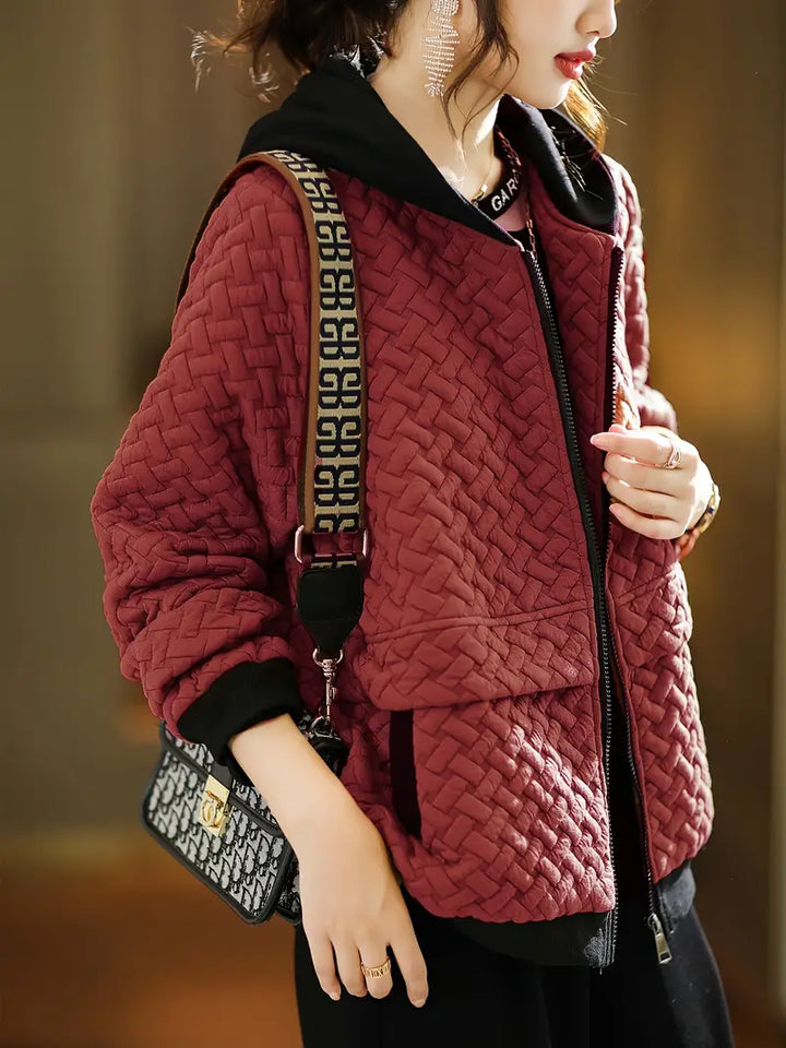 Close-up of the cozy hood on a women's quilted zip-up hoodie, providing extra warmth and comfort.
