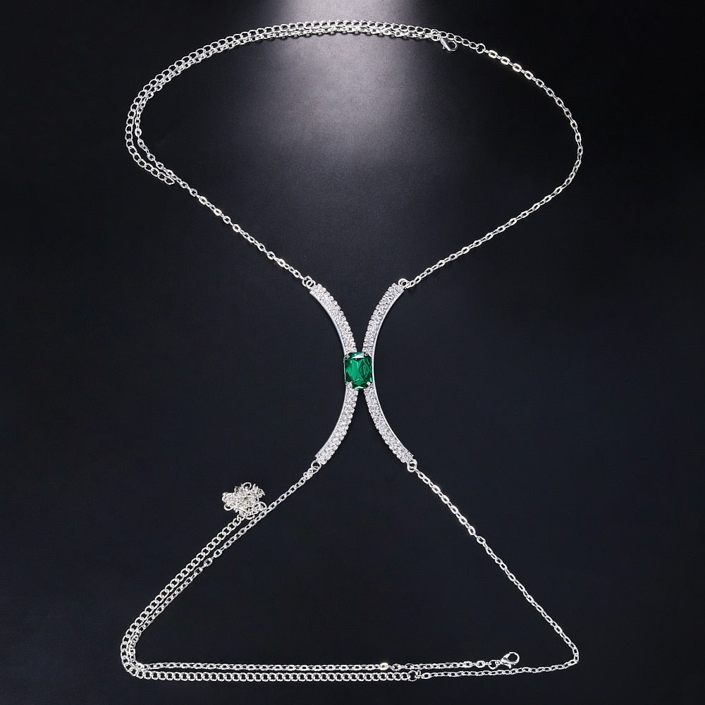 Woman modeling a dazzling crystal rhinestone body chain necklace, a stunning and glamorous evening wear accessory.