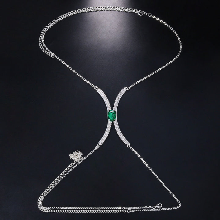 Woman modeling a dazzling crystal rhinestone body chain necklace, a stunning and glamorous evening wear accessory.