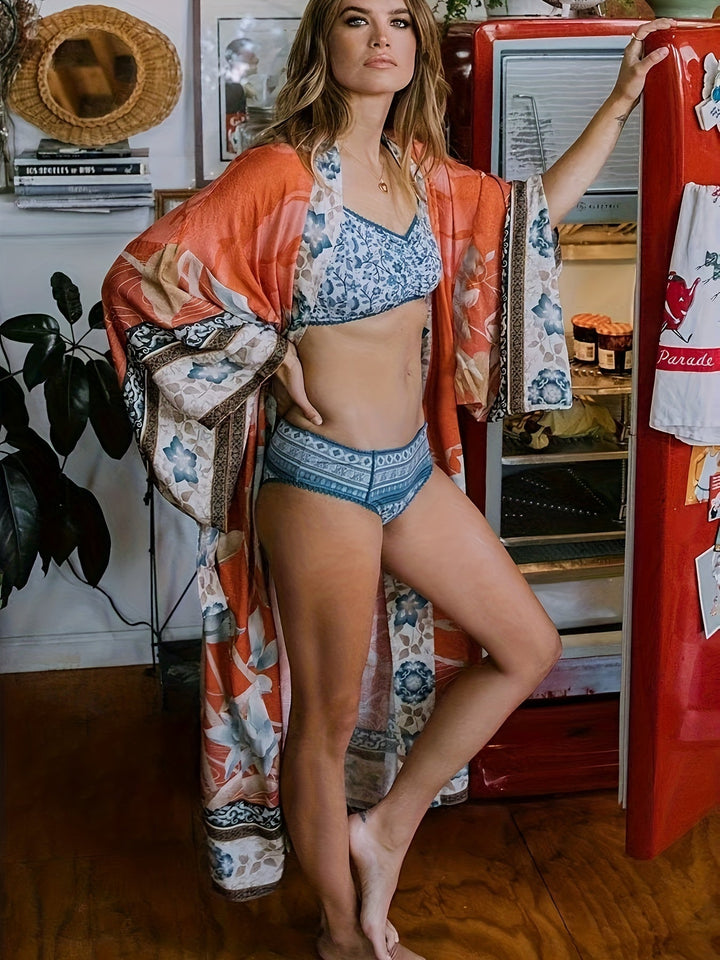 Lightweight red floral kimono for women, an elegant beach cover-up and resort wear.