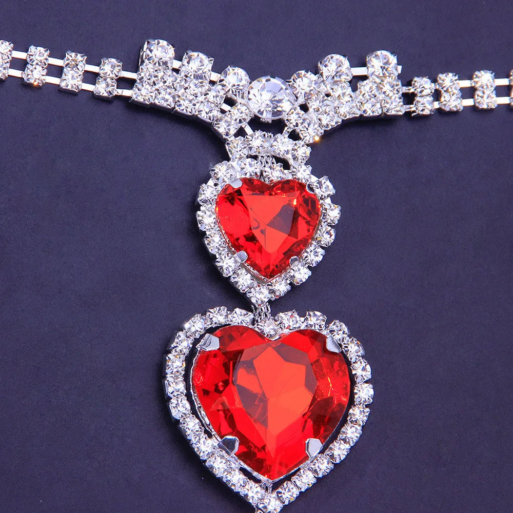 Stylish women's red heart rhinestone body chain for intimate wear. Crystal jewelry accessory.