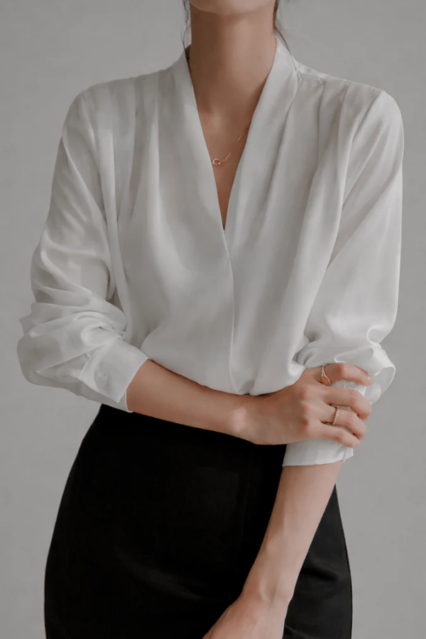Women's refined wrap blouse, long sleeve for elegant everyday wear. Perfect chic office or versatile top.