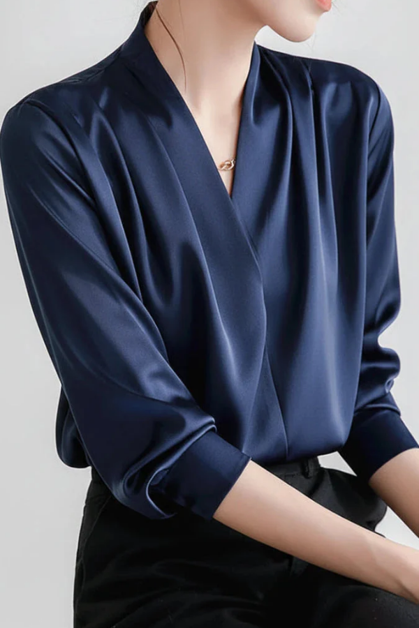Stylish women's long sleeve wrap blouse. Refined top, ideal for chic office wear or elegant, versatile everyday outfits.