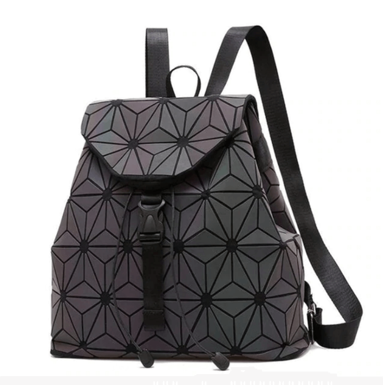 Close-up of the reflective geometric pattern on a women's color-changing luminous backpack, a unique stylish bag.