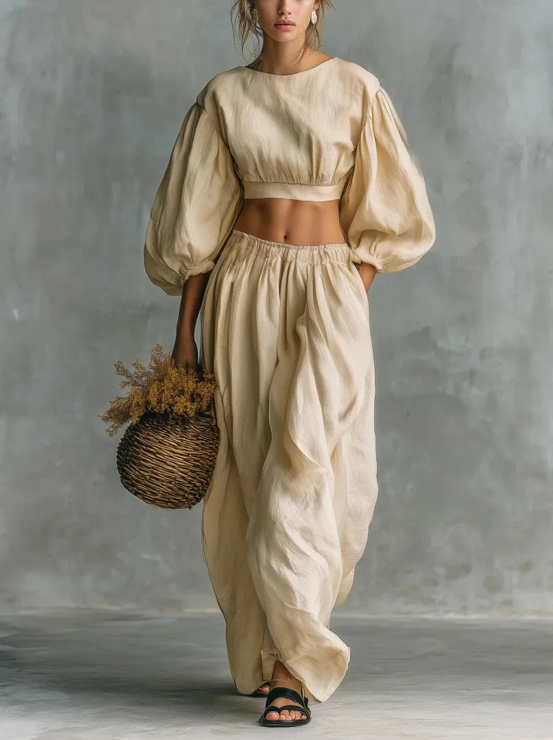 Fashionable women's relaxed balloon sleeve two-piece set for a chic casual or vacation look. Wide leg pants.