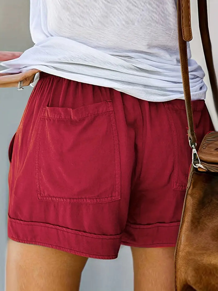 Stylish women's high-rise relaxed shorts in breathable cotton blend, great for casual summer days.