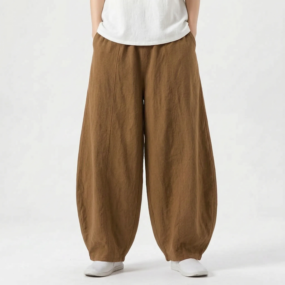 Women's relaxed fit barrel pants with functional pockets, wide leg, and elastic waist for comfort.